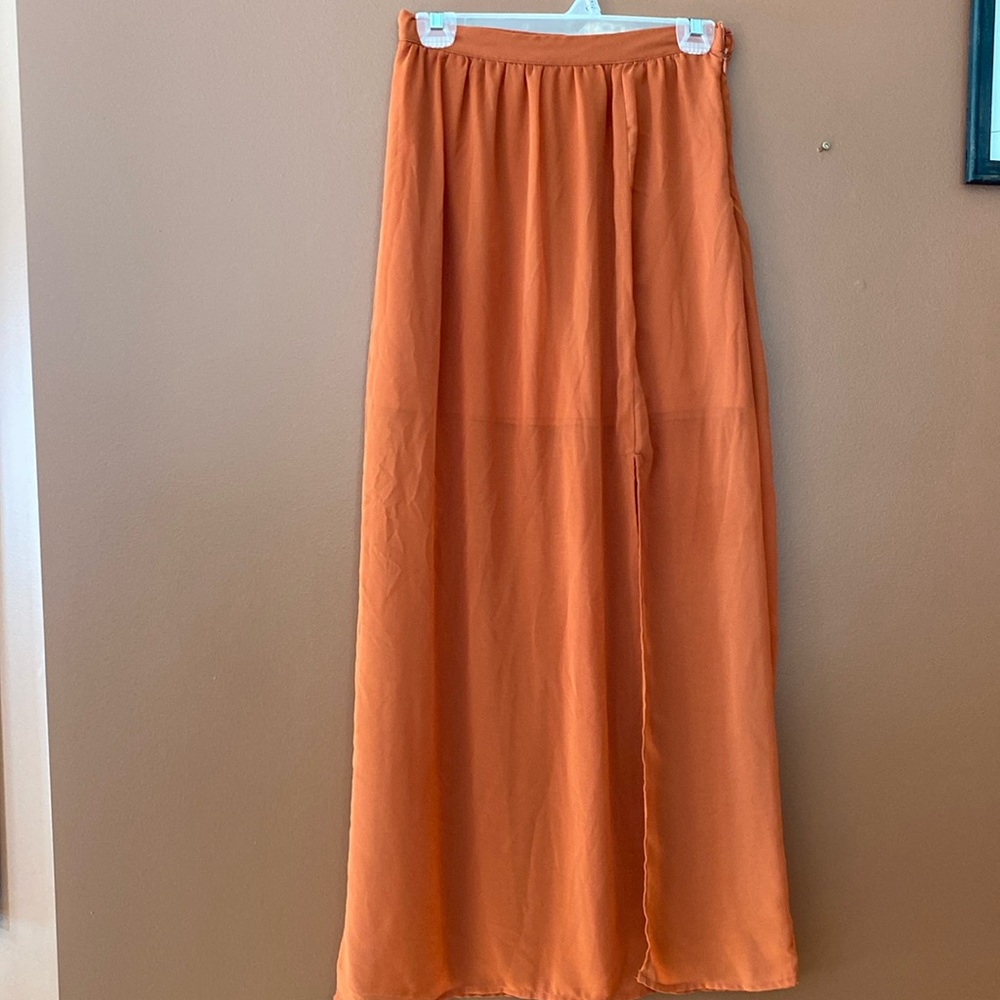 XXI essentials ladies orange skirt in size XS with lining to mid thigh